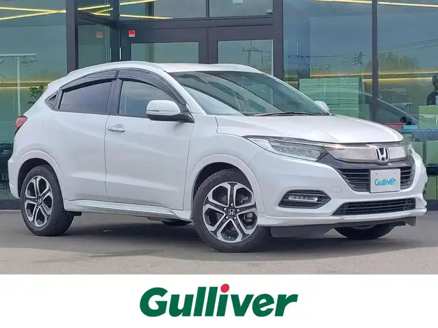 ホンダ ヴェゼル ハイブリッド Z ホンダセンシング 東京都 2018(平30)年 4.9万km プラチナホワイトパール Honda SENSING/・衝突軽減ブレーキ/・車線維持支援システム/・アダプティブクルーズコントロール/パドルシフト/純正８インチメモリーナビ（VXM-187VFEi）/フルセグTV/バックカメラ/ETC/ドライブレコーダー (DRX-GFR01)/ハーフレザーシート/シートヒーター/純正フロアマット/LEDヘッドライト/オートライト/電動コーナーポール/17インチ純正アルミホイール