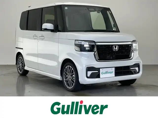 ホンダ Ｎ ＢＯＸ カスタム ターボ 愛知県 2025(令7)年 0.4万km プラチナホワイトパール 純正８型ナビ　バックカメラ　ＥＴＣ　禁煙車　純正前後ドラレコ　黒ハーフレザー　フルセグＴＶ　ホンダセンシング　衝突軽減　両側電動スライド　シートヒーター　誤発進抑制　追従クルコン　ＬＥＤオートライト　