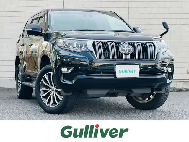 トヨタ ランドクルーザー プラド TX Lパッケージ 大分県 2018(平30)年 6.5万km ブラック 純正19インチAW【MOP】/（切削光輝＋ダークグレーメタリック塗装）/純正ナビ(NSZT-W68T)/【フルセグTV/Bluetooth/DVD/CD/SD】/Toyota Safety Sense/・プリクラッシュセーフティ/・レーンディパーチャーアラート/・オートマチックハイビーム/・レーダークルーズコントロール/ヘッドライトウォッシャー/DN席シートベンチレーション/DN席快適温熱シート/DN席パワーシート/合成皮革シート/本革巻きシフトノブ＆パーキングブレーキレバー/バックカメラ/ETC/電動格納ミラー/ウィンカーミラー/プッシュスタート /スマートキー2本/保証書/取扱説明書