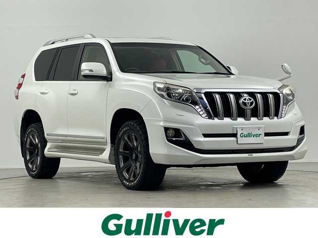 トヨタ ランドクルーザー プラド TX 岐阜県 2016(平28)年 11.7万km ホワイトパールクリスタルシャイン サンルーフ/モデリスタエアロ/シートカバー/トヨタセーフティセンス/・レーンディパーチャーアラート/・プリクラッシュセーフティ/カロッツェリアHDDナビ/（CD/DVD/フルセグ/Bluetooth/HDMI）/バックカメラ/オートLEDヘッドライト/前方ドライブレコーダー/ビルトインETC/スマートキー/スペアキー/電動格納ミラー/保証書/取扱説明書