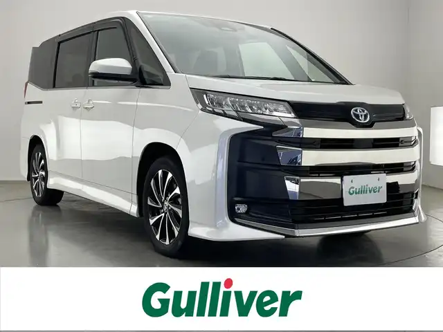 トヨタ ノア ハイブリッド S－Z 愛知県 2023(令5)年 6.7万km ホワイトパールクリスタルシャイン 純正１０．５型ナビ　純正１４型後席モニター　禁煙　バックカメラ　ＤＶＤ　フルセグ　セーフティセンス　ＡＣ１００Ｖ　ＨＤＭＩ　前後ドラレコ　ＥＴＣ２．０　シートヒーター　追従クルコン　衝突軽減　車線逸脱　両側パワースライドドア　純正フロアマット　LEDオートハイビーム　ハーフレザー