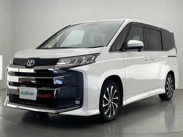 トヨタ ノア ハイブリッド S－Z 愛知県 2023(令5)年 6.7万km ホワイトパールクリスタルシャイン 純正１０．５型ナビ　純正１４型後席モニター　禁煙　バックカメラ　ＤＶＤ　フルセグ　セーフティセンス　ＡＣ１００Ｖ　ＨＤＭＩ　前後ドラレコ　ＥＴＣ２．０　シートヒーター　追従クルコン　衝突軽減　車線逸脱　両側パワースライドドア　純正フロアマット　LEDオートハイビーム　ハーフレザー