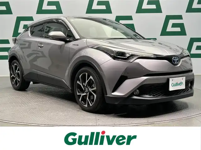 トヨタ Ｃ－ＨＲ G 鹿児島県 2017(平29)年 7.8万km メタルストリームM トヨタセーフティセンス/　・プリクラッシュセーフティシステム/　・レーンディパーチャーアラート/　・オートマチックハイビーム/　・全車速追従機能付レーダークルーズコントロール/リアクロストラフィックアラート/ロードサインアシスト/純正9インチSDナビ【NSZT-W66T】/　（CD/DVD/フルセグ/Bluetooth/SD）/ビルトインETC/純正前方ドライブレコーダー【DRT-H66A】/バックカメラ/前席シートヒーター/革巻きステアリング/ステアリングリモコン/純正LEDヘッドライト/フロントフォグランプ/オートライト/前後コーナーセンサー/電動パーキングブレーキ/オートホールド/オートワイパー/純正フロアマット/純正ドアバイザー/純正18インチアルミ