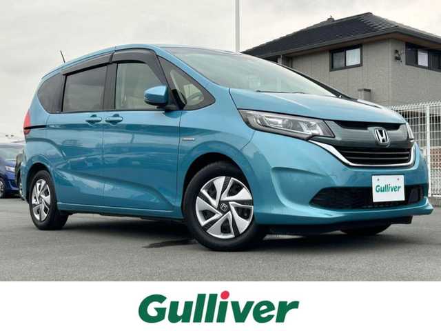 ホンダ フリード ハイブリット G ホンダセンシング 静岡県 2018(平30)年 5.7万km ブルーホライゾンM エンジンスタートボタン/パワーステアリング/パワーウィンドウ/寒冷地仕様/アイドリングストップ/スマートキー/オートエアコン/クルーズコントロール/純正ETC/バックカメラ/純正メモリナビ（CD/BT/ワンセグ）/ドライブレコーダー/3列シート/ウォークスルー/純正フロアマット/両側パワースライドドア/純正アルミホイール/ABS/横滑り防止装置/レーンキープアシスト/オートライト/LEDヘッドライト/Wエアバック/衝突軽減システム