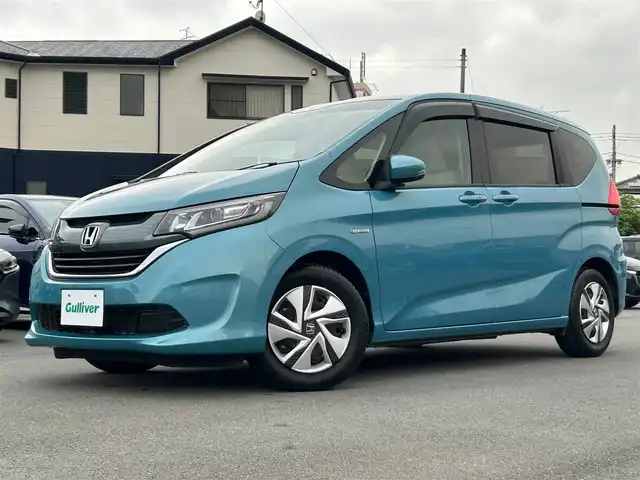 ホンダ フリード ハイブリット G ホンダセンシング 静岡県 2018(平30)年 5.7万km ブルーホライゾンM エンジンスタートボタン/パワーステアリング/パワーウィンドウ/寒冷地仕様/アイドリングストップ/スマートキー/オートエアコン/クルーズコントロール/純正ETC/バックカメラ/純正メモリナビ（CD/BT/ワンセグ）/ドライブレコーダー/3列シート/ウォークスルー/純正フロアマット/両側パワースライドドア/純正アルミホイール/ABS/横滑り防止装置/レーンキープアシスト/オートライト/LEDヘッドライト/Wエアバック/衝突軽減システム