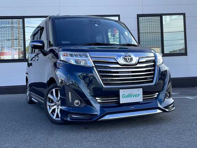 トヨタ ルーミー カスタムG－T 山口県 2020(令2)年 4.9万km ブラックマイカメタリック/レーザーブルークリスタルシャイン 2トーン 純正9インチSDナビ　【NSZT-Y68T】/・Bluetooth接続/・フルセグTV/・DVD再生機能有/・バックカメラ/ETC2.0/ドライブレコーダー/Toyota Safety Sense/・衝突警報機能/・誤発進抑制制御機能/・車線逸脱警報機能/・先行者発進お知らせ機能/・レーダークルーズコントロール/純正フロアマット/両側パワースライドドア/シートヒーター/純正15インチアルミホイール/純正LEDライト/フォグライト/オートマチックハイビーム/フロントエアロ　【モデリスタ】/ドアバイザー/クリアランスソナー/保証書/取扱説明書