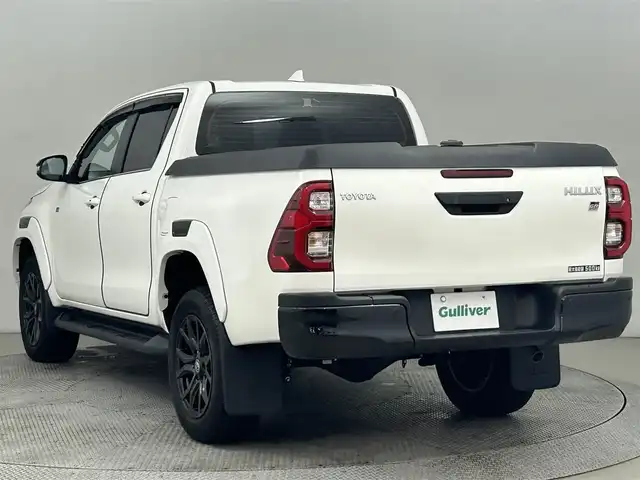 トヨタ ハイラックス Z GRスポーツ 道央・札幌 2023(令5)年 3万km スーパーホワイトⅡ ・寒冷地仕様/・パートタイム４WD/・純正ディスプレイオーディオナビ/　Bluetooth/Miracast/USB/・ステアリングスイッチ/・パノラミックビューモニター/・ETC/・トヨタセーフティセンス/　PCS/LDA/RSA/先行車発進告知/・アダプティブクルーズコントロール/・クリアランスソナー/・横滑り防止装置/・ABS/・ダウンヒルアシストコントロール/・ECO/PWRモード/・パドルシフト/・オートLSD/・リヤデフロック/・MOPハードトノカバー/・荷台LINE-X施工済/・weathertec製ゴムマット/・バイザー/・LEDヘッドライト/・LEDフォグランプ/・ウィンカーミラー/・ミラーヒーター/・純正１８インチAW/・レッドキャリパー/・GRロゴ入り専用ハーフレザーシート/・D席パワーシート/・プッシュスタート/・スマートキー/・スペアキー