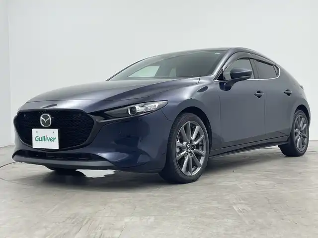 マツダ マツダ３ファストバック 15S ツーリング 三重県 2020(令2)年 2.6万km ディープクリスタルブルーマイカ 禁煙車/マツダコネクトナビ/　フルセグTV/DVD/USB/Bluetooth/全方位カメラ/デュアルオートAC/MTモード付きAT/革巻きステアリング/ステアリングスイッチ/レーダークルーズコントロール/PCS/LKA/BSM/オートハイビーム/前後コーナーセンサー/アイドリングストップ/ETC/純正LEDヘッドライト/サイド/カーテンエアバック