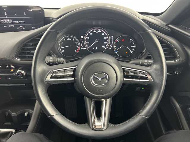 マツダ マツダ３ファストバック 15S ツーリング 愛知県 2020(令2)年 2.6万km ディープクリスタルブルーマイカ 禁煙車/純正10.25インチナビ/（フルセグTV/DVD/CD/USB/Bluetooth/HDMI)/全方位カメラ/i-ActiveSense/・衝突軽減ブレーキ/・レーンキープアシスト/・レーダークルーズコントロール/・オートマチックハイビーム/・ブラインドスポットモニター/・コーナーセンサー/ヘッドアップディスプレイ/ETC/アイドリングストップ/純正18インチアルミホイール/スマートキー/プッシュスタート/スペアキー1本/LEDヘッドライト/オートライト/純正フロアマット/横滑り防止装置/電動格納ミラー/電子パーキングブレーキ/オートホールド