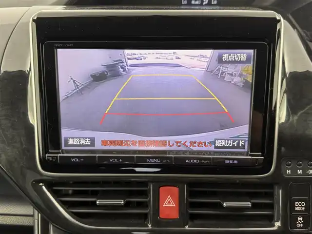 トヨタ ノア Si 愛知県 2014(平26)年 7.7万km ホワイトパールクリスタルシャイン 純正9インチナビ/　　CD/DVD/BT/フルセグ/バックカメラ/ビルトインETC/革巻きステアリング/ステアリングリモコン/アイドリングストップ/後席フリップダウンモニター/キャプテンシート/両側パワースライドドア/純正LEDヘッドライト/フォグランプ/純正16インチアルミホイール/取扱説明書/保証書