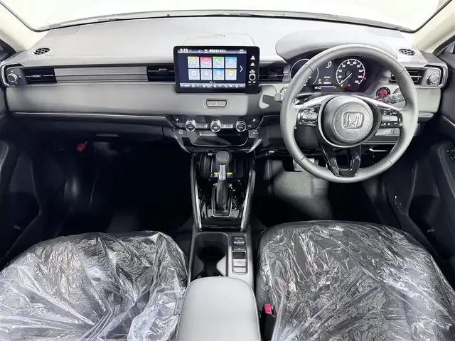 ホンダ ヴェゼル ハイブリッド e:HEV Z 大阪府 2025(令7)年 0.1千km プラチナホワイトパール 純正ナビ /シートヒーター /ホンダセンシング/レーダークルコン　/コーナーセンサー　/レーンアシスト　/ＬＥＤヘッドライト　/電動リアゲート　/プッシュスタート　/ブラインドスポットモニター　/オートライト/オートエアコン/電格ミラー　/ハンドルヒーター