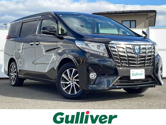 トヨタ アルファードハイブリット G 岩手県 2016(平28)年 2.9万km ブラック 9型ナビ バックC 電動リアゲート 両側電動スライドドア フルセグ DVD再生 メモリ付電動シート レーダークルーズコントロール AC100Vコンセント ビルドインETC オットマン 純正17インチAW オートLEDライト フォグ