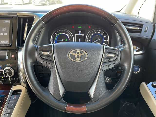 トヨタ アルファードハイブリット G 岩手県 2016(平28)年 2.9万km ブラック 9型ナビ バックC 電動リアゲート 両側電動スライドドア フルセグ DVD再生 メモリ付電動シート レーダークルーズコントロール AC100Vコンセント ビルドインETC オットマン 純正17インチAW オートLEDライト フォグ