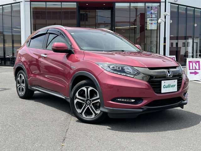ホンダ ヴェゼル ハイブリッド X ホンダセンシング ブリリアントスタイルED 宮城県 2017(平29)年 6.7万km ルージュアメジストM 登録時走行距離66252km/純正ナビ【ＢＴ／ＣＤ／ＤＶＤ／ＳＤ】/ホンダセンシング　/レーダークルーズコントロール　/パドルシフト　/ルーフレール　/バックカメラ　/電動格納ミラー　/ドライブレコーダー　/純正１７インチＡＷ/純正フロアマット/プッシュスタート/スマートキー/MTモード付/ビルトインETC/LEDヘッドライト/オートライト/禁煙車