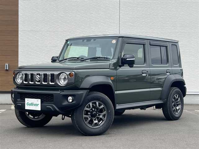 スズキ ジムニー ノマド FC 秋田県 2025(令7)年 0.1万km 緑 ４WD/衝突軽減システム/LEDヘッドライト/純正アルミ/スマートキー/アイドリングストップ/プッシュスタート/レーンキープアシスト/ダウンヒルアシストコントロール/クルーズコントロール/オートマチックハイビーム/ステアリングスイッチ/前席シートヒーター/純正フロアマット/純正ドアバイザー/オートライト/オートエアコン/パワーステアリング/パワーウィンドウ/ヘッドライトウォッシャー/ミラーヒーター/横滑り防止/レベライザー/電動格納ウィンカーミラー/保証書/取扱説明書/記録簿