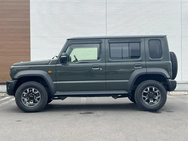 スズキ ジムニー ノマド FC 秋田県 2025(令7)年 0.1万km 緑 ４WD/衝突軽減システム/LEDヘッドライト/純正アルミ/スマートキー/アイドリングストップ/プッシュスタート/レーンキープアシスト/ダウンヒルアシストコントロール/クルーズコントロール/オートマチックハイビーム/ステアリングスイッチ/前席シートヒーター/純正フロアマット/純正ドアバイザー/オートライト/オートエアコン/パワーステアリング/パワーウィンドウ/ヘッドライトウォッシャー/ミラーヒーター/横滑り防止/レベライザー/電動格納ウィンカーミラー/保証書/取扱説明書/記録簿