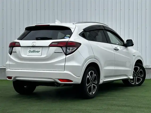 ホンダ ヴェゼル ハイブリッド Z 香川県 2014(平26)年 5.9万km ホワイトオーキッドパール 登録時走行距離 58278km/純正ナビ/→AM/FM/TV/Bluetooth/バックカメラ/ETC/ドライブレコーダー/クルーズコントロール/パドルシフト/オートホールド機能付き電子パーキングブレーキ/ハーフレザーシート/前席シートヒーター/LEDオートライト/フォグランプ/プッシュスタート/スマートキー/スペアキー
