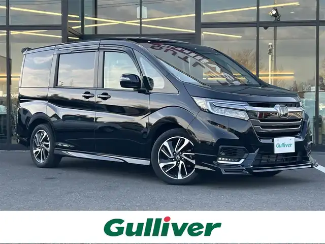 ホンダ ステップワゴン スパーダ ホンダセンシング 栃木県 2018(平30)年 5.5万km プレミアムスパークルブラックパール ホンダセンシング/・衝突軽減ブレーキ（CMBS）/・誤発進抑制機能/・先行車発進お知らせ機能/・路外逸脱抑制機能（RDMS）/・標識認識機能/・VSA（車両挙動安定化制御システム）/純正フリップダウンモニター/純正9インチナビ/フルセグTV/DVD/Bluetooth/USB/TVキャンセラー/バックカメラ/ビルトインETC/前席シートヒーター/両側パワースライドドア/アダプティブクルーズコントロール/スマートキー×2/プッシュEgスタート/ステアリングリモコン/LEDオートライト/LEDフォグランプ/純正17インチAW/アイドリングストップ/横滑り防止装置/パドルシフト/無限フロアマット