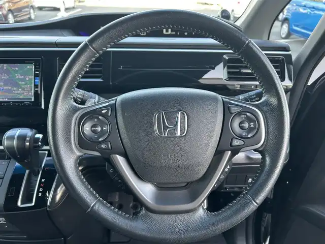 ホンダ ステップワゴン スパーダ ホンダセンシング 栃木県 2018(平30)年 5.5万km プレミアムスパークルブラックパール ホンダセンシング/・衝突軽減ブレーキ（CMBS）/・誤発進抑制機能/・先行車発進お知らせ機能/・路外逸脱抑制機能（RDMS）/・標識認識機能/・VSA（車両挙動安定化制御システム）/純正フリップダウンモニター/純正9インチナビ/フルセグTV/DVD/Bluetooth/USB/TVキャンセラー/バックカメラ/ビルトインETC/前席シートヒーター/両側パワースライドドア/アダプティブクルーズコントロール/スマートキー×2/プッシュEgスタート/ステアリングリモコン/LEDオートライト/LEDフォグランプ/純正17インチAW/アイドリングストップ/横滑り防止装置/パドルシフト/無限フロアマット