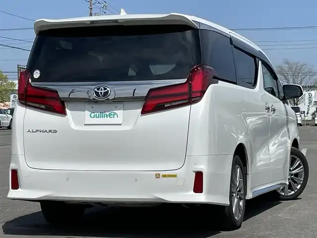 トヨタ アルファード S タイプゴールド 道央・札幌 2020(令2)年 8.3万km ホワイトパールクリスタルシャイン ４WD/純正ディーラーOPナビ/CD/DVD/BT/フルセグ/純正フリップダウンモニター/トヨタセーフティセンス/プリクラッシュセーフティ/横滑り防止装置/レーダークルーズコントロール/レーンキープアシスト/クリアランスソナー/パーキングサポートブレーキ/ロードサインアシスト/バックカメラ/ビルトインETC2.0/ドライブレコーダー/アイドリングストップ/ECOMODE/両側パワースライドドア/パワーバックドア/2列目オットマン/ハーフレザーシート/革巻きウッドコンビステアリング/ステアリングリモコン/AC100V/電動パーキング/ブレーキホールド/MTモード付AT/レーダー探知機/プッシュスタート/スマートキー/LEDヘッドライト/オートライト/オートハイビーム/フォグランプ/電動格納ミラー/ウィンカーミラー/純正フロアマット/ドアバイザー/スペアキー