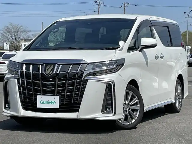 トヨタ アルファード S タイプゴールド 道央・札幌 2020(令2)年 8.3万km ホワイトパールクリスタルシャイン ４WD/純正ディーラーOPナビ/CD/DVD/BT/フルセグ/純正フリップダウンモニター/トヨタセーフティセンス/プリクラッシュセーフティ/横滑り防止装置/レーダークルーズコントロール/レーンキープアシスト/クリアランスソナー/パーキングサポートブレーキ/ロードサインアシスト/バックカメラ/ビルトインETC2.0/ドライブレコーダー/アイドリングストップ/ECOMODE/両側パワースライドドア/パワーバックドア/2列目オットマン/ハーフレザーシート/革巻きウッドコンビステアリング/ステアリングリモコン/AC100V/電動パーキング/ブレーキホールド/MTモード付AT/レーダー探知機/プッシュスタート/スマートキー/LEDヘッドライト/オートライト/オートハイビーム/フォグランプ/電動格納ミラー/ウィンカーミラー/純正フロアマット/ドアバイザー/スペアキー