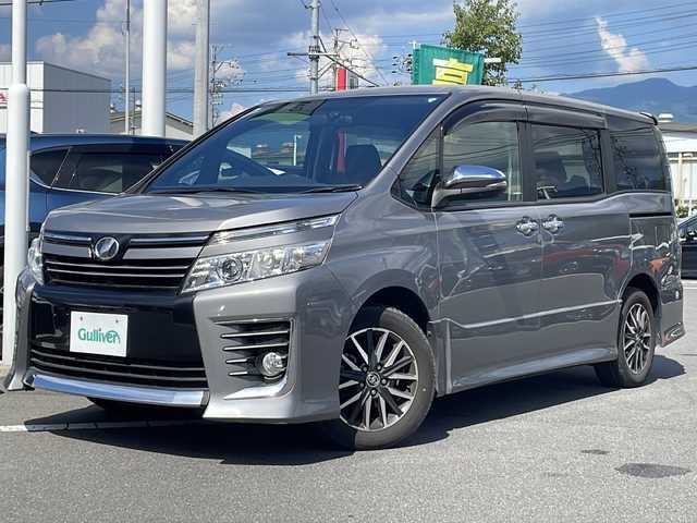 トヨタ ヴォクシー ZS 煌 長野県 2015(平27)年 5.4万km アイスチタニウムマイカメタリック ９インチ純正ナビ/Bluetooth Audio/フルセグテレビ/前方ドライブレコーダー/ＥＴＣ/バックカメラ/両側電動スライドドア/ＬＥＤヘッドライト/純正フロアマット/プッシュスタート/オートライト/ドアバイザー/スマートキー/スペアキー×１/横滑り防止機能/盗難防止機能