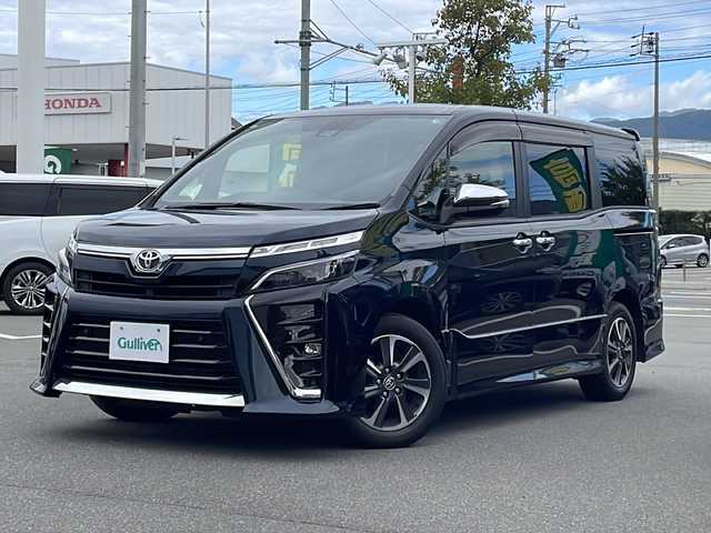 トヨタ ヴォクシー ZS 煌Ⅲ 長野県 2021(令3)年 2.7万km ブラッキッシュアゲハガラスフレーク セーフティーセンス/・プリクラッシュセーフティ/・レーンディパーチャーアラート/・オートマチックハイビーム/・先行車発進告知機能/・インテリジェントクリアランスソナー/純正９インチSDナビ【NSZT-Y68T】/（CD/DVD/フルセグTV/BT）/バックカメラ/ビルトインETC/フリップダウンモニター/両側パワースライドドア/革巻きステアリング/クルーズコントロール/ステアリングスイッチ/アイドリングストップ/MTモード付AT/LEDヘッドライト/フォグランプ/オートライト/ハーフレザーシート/スマートキー/Pスタート/電動格納ミラー/純正１６インチAW/純正フロアマット