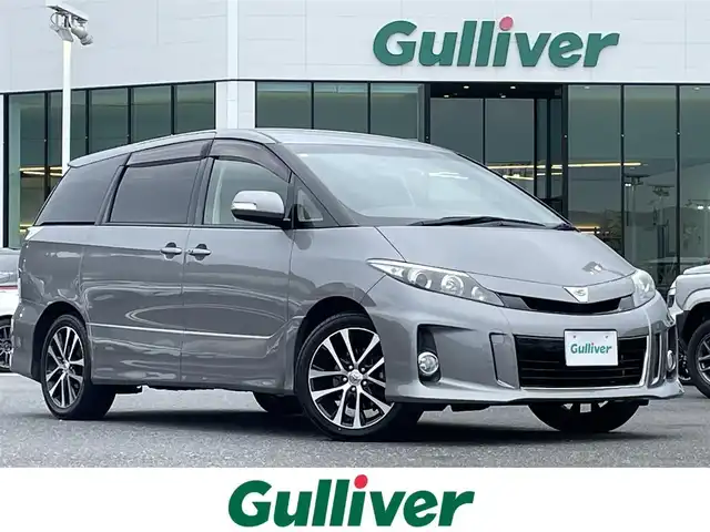 トヨタ エスティマ アエラス 島根県 2015(平27)年 8.9万km アイスチタニウムマイカメタリック 登録時走行距離88478km/ワンオーナー/純正ナビ(Bluetooth・AM・FM・CD・DVD)/フルセグTV/フリップダウンモニター/スマートキー(スペアキー×1)/クルーズコントロール/両側パワースライドドア/バックカメラ/純正フロアマット/純正18インチAW/HID/オートライト/フォグランプ/ウィンカーミラー/ステアリングスイッチ/革巻きステアリング/禁煙車