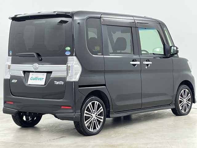 ダイハツ タント カスタム RS SA 道央・札幌 2015(平27)年 6.8万km ブラックマイカメタリック ・禁煙車/・4WD/・純正ナビ&CD&DVD&BT&SD&HDMI&iPod&USB/・純正フリップダウンモニター/・両側パワースライドドア/・バックカメラ/・衝突被害軽減ブレーキ/・横滑り防止装置/・アイドリングストップ/・ETC/・nanoe/・USB入力端子/・純正フロアマット/・電動格納ミラー/・LEDヘッドライト/・オートライト/・スマートキー/・スペアキー/・純正エンジンスターター