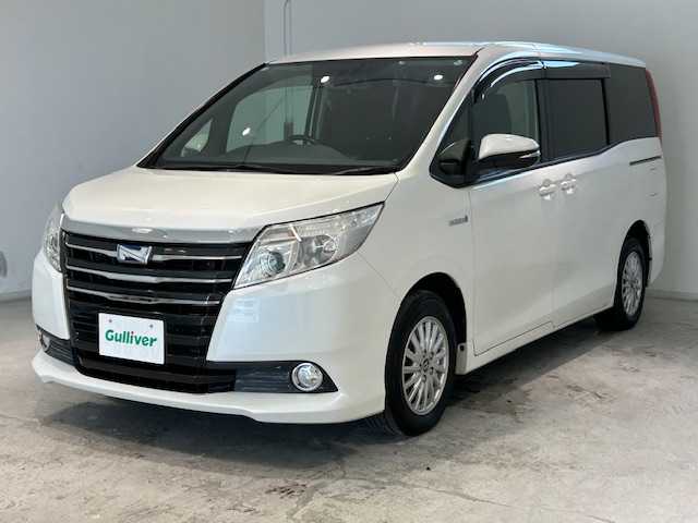 トヨタ ノア ハイブリッド G 宮城県 2014(平26)年 12.9万km ホワイトパールクリスタルシャイン クルーズコントロール/レーンキープアシスト/オートライト/フリップダウンモニター（アルパイン）/社外SD9インチナビ（アルパインX９００）/純正ビルドインETC/Bluetooth接続/ドライブレコーダー前後/バックカメラ/片側スライドドア/ウォークスルー/3列シート/純正フロアマット/純正15インチアルミホイール/LEDヘッドライト/衝突軽減システム