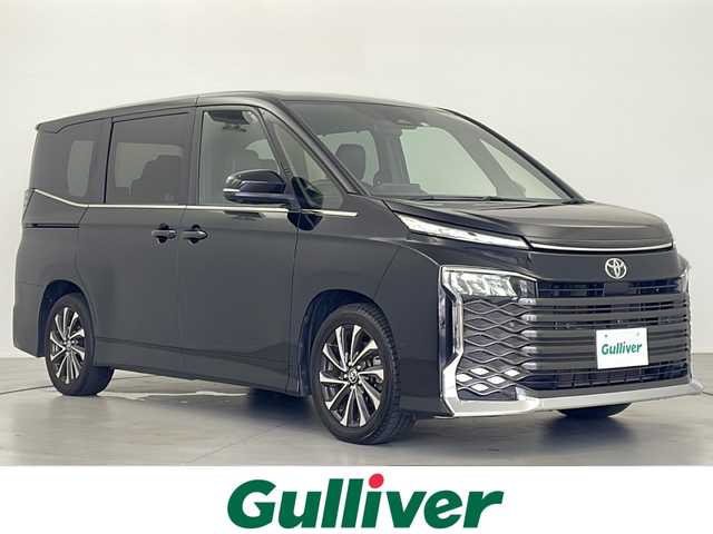 トヨタ ヴォクシー S－Z 岐阜県 2022(令4)年 6万km アティチュードブラックマイカ T-connectナビ/AM FM/Bluetooth /Miracast/アラウンドビューモニター/快適利便パッケージHigh /・ハンズフリーデュアルパワースライドドア（挟み込み防止機能付）/・パワーバックドア（挟み込み防止機能・停止位置メモリー機能・パワーバックドアスイッチ付）/・ナノイー X/・ステアリングヒーター/・キャプテンシート/・シートヒーター（D/N）/・オットマン/・角度調整付アームレスト/ブラインドスポットビューモニター/クリアランスソナー/革巻きステアリング/ステアリングリモコン/ETC/オートライト/オートハイビーム/ヘッドライトレベライザー/ドライバーモニター