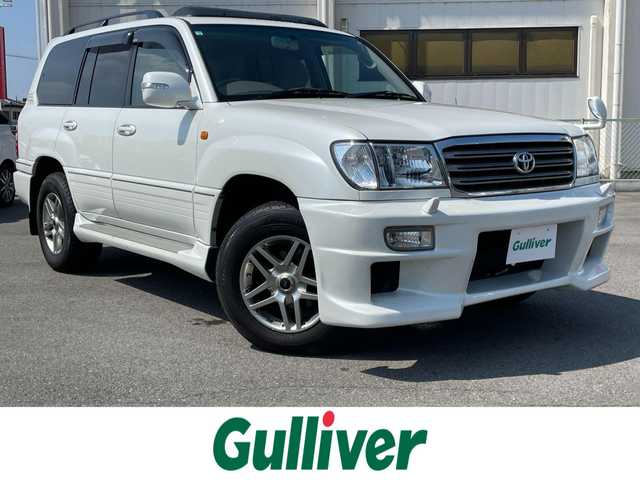 トヨタ ランドクルーザー VX－LTD Gセレクション 群馬県 2004(平16)年 9.6万km ホワイトパールクリスタルシャイン 安全装備/・クルーズコントロール/・オートライト/純正DVDナビ/・AM/FM/CD/MD/バックカメラ/サンルーフ/前席パワーシート/前席シートヒーター/4WD/ETC/ハイトコントロール/フォグランプ/社外エアロ/純正フロアマット/純正ドアバイザー