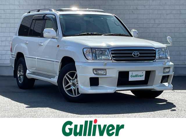 トヨタ ランドクルーザー VX－LTD Gセレクション 群馬県 2004(平16)年 9.6万km ホワイトパールクリスタルシャイン 安全装備/・クルーズコントロール/・オートライト/純正DVDナビ/・AM/FM/CD/MD/バックカメラ/サンルーフ/前席パワーシート/前席シートヒーター/4WD/ETC/ハイトコントロール/フォグランプ/社外エアロ/純正フロアマット/純正ドアバイザー