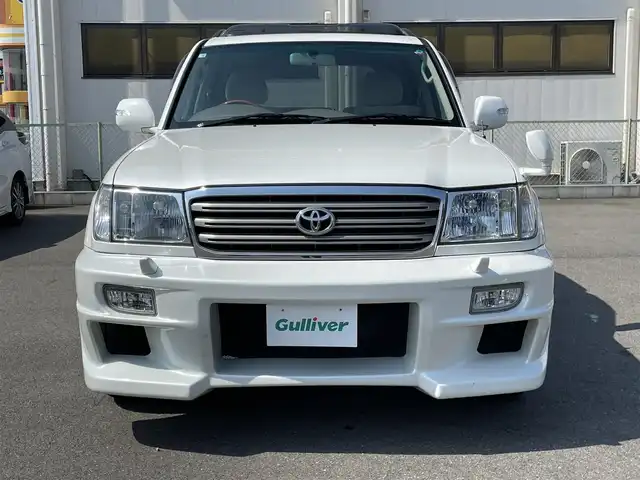 トヨタ ランドクルーザー VX－LTD Gセレクション 群馬県 2004(平16)年 9.6万km ホワイトパールクリスタルシャイン 安全装備/・クルーズコントロール/・オートライト/純正DVDナビ/・AM/FM/CD/MD/バックカメラ/サンルーフ/前席パワーシート/前席シートヒーター/4WD/ETC/ハイトコントロール/フォグランプ/社外エアロ/純正フロアマット/純正ドアバイザー