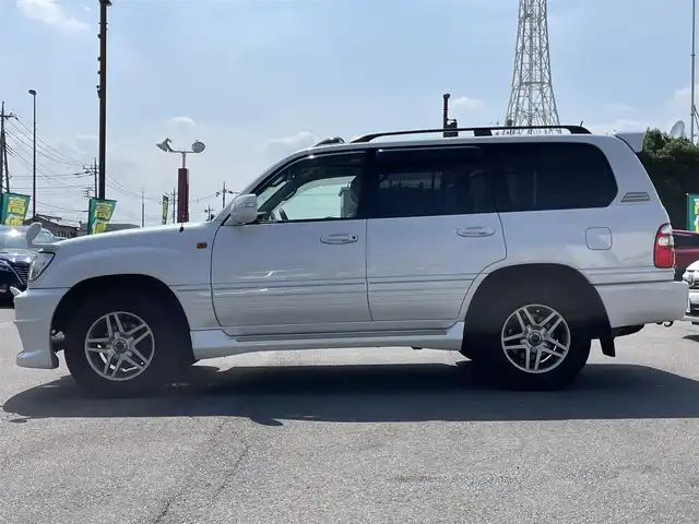 トヨタ ランドクルーザー VX－LTD Gセレクション 群馬県 2004(平16)年 9.6万km ホワイトパールクリスタルシャイン 安全装備/・クルーズコントロール/・オートライト/純正DVDナビ/・AM/FM/CD/MD/バックカメラ/サンルーフ/前席パワーシート/前席シートヒーター/4WD/ETC/ハイトコントロール/フォグランプ/社外エアロ/純正フロアマット/純正ドアバイザー