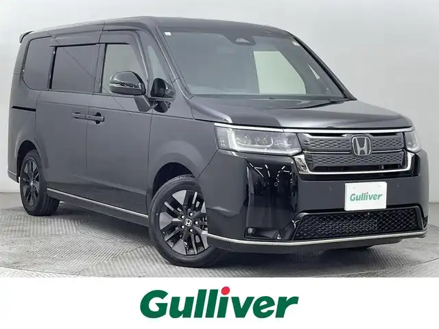 ホンダ ステップワゴン スパーダ 道央・札幌 2023(令5)年 0.4万km クリスタルブラックパール ・ワンオーナー/・寒冷地仕様/・４WD/・DOPギャザーズナビ（LXM-232VFEi）/　CD/DVD/BT/SD/USB/フルセグTV/・ステアリングスイッチ/・バックカメラ/・ビルトインETC/・ホンダセンシング/　CMBS/LKAS/BSM/PKSB/　標識認識/先行車発進告知/・クリアランスソナー/・横滑り防止装置/・アイドリングストップ/・ECON/・ブレーキホールド/・パドルシフト/・パワーバックドア/・両側パワースライドドア/・オートマチックハイビーム/・オートライト/・ヘッドランプレベライザー/・LEDヘッドランプ＆フォグランプ/・ドアミラーウィンカー/・ミラーヒーター/・ハーフレザーシート/・D+N席シートヒーター/・シートバックテーブル/・２列目格納式サンシェード/・純正１６インチAW/・純正フロアマット/・純正ドアバイザー/・プッシュスタート/・スマートキー
