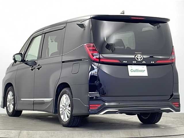 トヨタ ノア S－G 大阪府 2024(令6)年 2.4万km アティチュードブラックマイカ モデリスタエアロ/純正10.5型ディスプレイオーディオナビ/【フルセグTV/AM/FM/CD/DVD/BT/USB/HDMI】/快適利便パッケージ(mid)/・ハンズフリーパワースライドドア/・左右独立フロント＋リアエアコン/・D/N席シートヒーター/・独立センターコンソール/・nanoe/TVキャンセラー/バックカメラ/両側パワースライドドア/ToyotaSafetySense/・プリクラッシュセーフティ/・レーントレーシングアシスト＋レーンディパーチャーアラート/・レーダークルーズコントロール/・アダプティブハイビームシステム/・ロードサインアシスト/・ドライバー異常時対応システム/・プロアクティブドライビングアシスト/・発進遅れ告知機能/パーキングサポートブレーキ/車両接近通報装置/アイドリングストップ/オートホールド/ビルトインETC2.0/WAC/後席サンシェード/純正16インチAW/純正フロアマット/スマートキー/サマータイヤ積込み