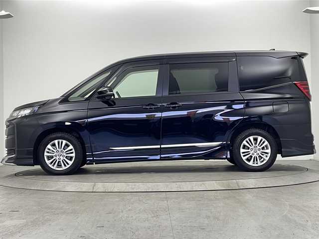 トヨタ ノア S－G 大阪府 2024(令6)年 2.4万km アティチュードブラックマイカ モデリスタエアロ/純正10.5型ディスプレイオーディオナビ/【フルセグTV/AM/FM/CD/DVD/BT/USB/HDMI】/快適利便パッケージ(mid)/・ハンズフリーパワースライドドア/・左右独立フロント＋リアエアコン/・D/N席シートヒーター/・独立センターコンソール/・nanoe/TVキャンセラー/バックカメラ/両側パワースライドドア/ToyotaSafetySense/・プリクラッシュセーフティ/・レーントレーシングアシスト＋レーンディパーチャーアラート/・レーダークルーズコントロール/・アダプティブハイビームシステム/・ロードサインアシスト/・ドライバー異常時対応システム/・プロアクティブドライビングアシスト/・発進遅れ告知機能/パーキングサポートブレーキ/車両接近通報装置/アイドリングストップ/オートホールド/ビルトインETC2.0/WAC/後席サンシェード/純正16インチAW/純正フロアマット/スマートキー/サマータイヤ積込み