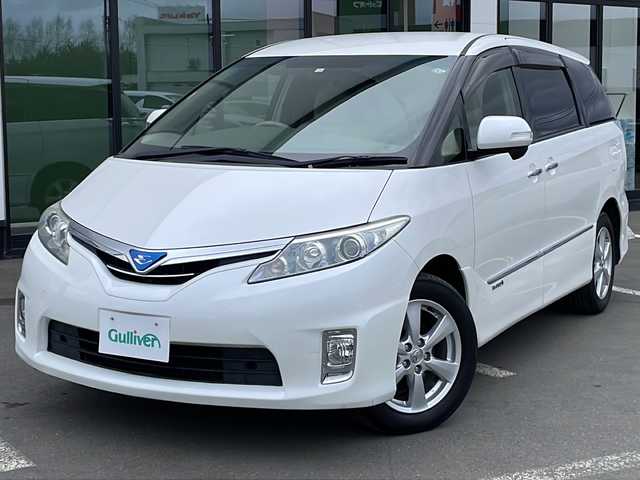 トヨタ エスティマ ハイブリッド X 道東・釧路十勝 2012(平24)年 8.8万km ホワイトパールクリスタルシャイン ・寒冷地仕様/・4WD/・純正HDDナビ/(FM・AM・CD・DVD・SD・HDD・BT)/・バックカメラ/・フリップダウンモニター/・両側パワースライドドア/・スマートキー/・プッシュスタート/・クルーズコントロール/・ETC/・HIDヘッドライト/・フォグライト/・オートライト/・オットマン/・100V充電/・電格ウィンカーミラー