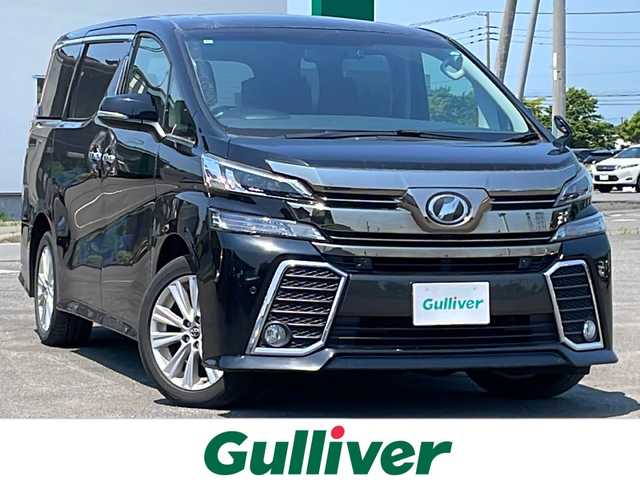 トヨタ ヴェルファイア Z 道央・札幌 2017(平29)年 7.5万km ブラック ４WD/寒冷地仕様/純正ディーラーOPナビ/CD/DVD/BT/フルセグ/純正フリップダウンモニター/プリクラッシュセーフティ/横滑り防止装置/レーダークルーズコントロール/クリアランスソナー/バックカメラ/ビルトインETC/ドライブレコーダー/アイドリングストップ/ワイパーデアイサー/ECOMODE/両側パワースライドドア/2列目オットマン/革巻きステアリング/ステアリングリモコン/電動パーキング/ブレーキホールド/MTモード付AT/プッシュスタート/スマートキー/LEDヘッドライト/オートライト/フォグランプ/電動格納ミラー/ウィンカーミラー/純正フロアマット