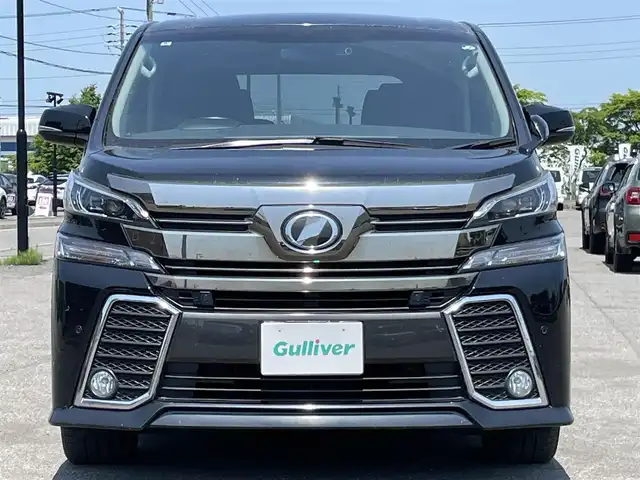トヨタ ヴェルファイア Z 道央・札幌 2017(平29)年 7.5万km ブラック ４WD/寒冷地仕様/純正ディーラーOPナビ/CD/DVD/BT/フルセグ/純正フリップダウンモニター/プリクラッシュセーフティ/横滑り防止装置/レーダークルーズコントロール/クリアランスソナー/バックカメラ/ビルトインETC/ドライブレコーダー/アイドリングストップ/ワイパーデアイサー/ECOMODE/両側パワースライドドア/2列目オットマン/革巻きステアリング/ステアリングリモコン/電動パーキング/ブレーキホールド/MTモード付AT/プッシュスタート/スマートキー/LEDヘッドライト/オートライト/フォグランプ/電動格納ミラー/ウィンカーミラー/純正フロアマット