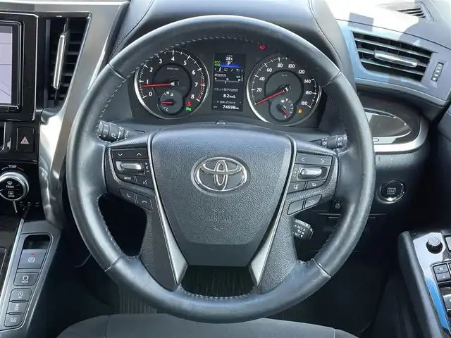トヨタ ヴェルファイア Z 道央・札幌 2017(平29)年 7.5万km ブラック ４WD/寒冷地仕様/純正ディーラーOPナビ/CD/DVD/BT/フルセグ/純正フリップダウンモニター/プリクラッシュセーフティ/横滑り防止装置/レーダークルーズコントロール/クリアランスソナー/バックカメラ/ビルトインETC/ドライブレコーダー/アイドリングストップ/ワイパーデアイサー/ECOMODE/両側パワースライドドア/2列目オットマン/革巻きステアリング/ステアリングリモコン/電動パーキング/ブレーキホールド/MTモード付AT/プッシュスタート/スマートキー/LEDヘッドライト/オートライト/フォグランプ/電動格納ミラー/ウィンカーミラー/純正フロアマット