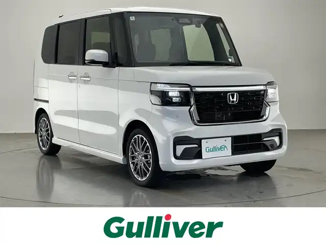 ホンダ Ｎ ＢＯＸ カスタム ターボ 愛知県 2025(令7)年 0.3万km プラチナホワイトパール 純正８型ナビ　ドラレコ　バックカメラ　禁煙車　ＥＴＣ　黒ハーフレザー　パドルシフト　ホンダセンシング　衝突軽減　追従クルコン　フルセグＴＶ　シートヒーター　ＬＥＤオートライト　両側電動スライド　ＵＳＢ