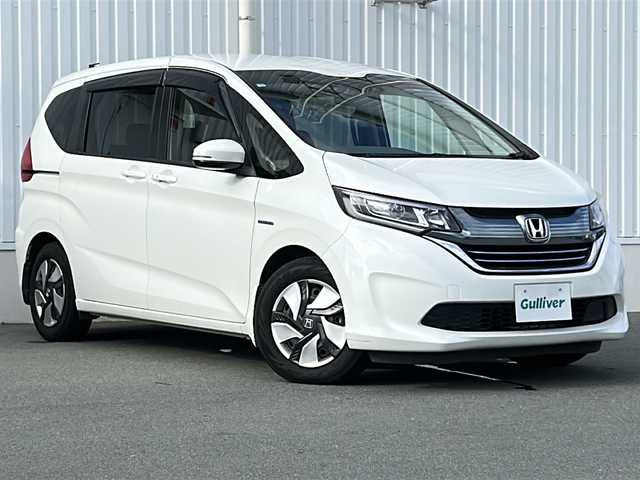 ホンダ フリード ハイブリット G ホンダセンシング 三重県 2016(平28)年 3.1万km ホワイトオーキッドパール 純正ナビ /バックカメラ /ビルトインETC /両側パワースライドドア /スペアキー /レーダークルーズコントロール /レーンキープアシスト /純正フロアマット /LEDヘッドライト/オートライト /ステアリングスイッチ/電子パーキング /電動格納ミラー/禁煙車