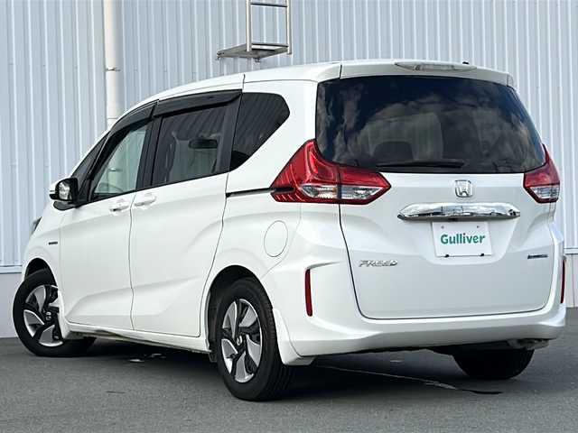 ホンダ フリード ハイブリット G ホンダセンシング 三重県 2016(平28)年 3.1万km ホワイトオーキッドパール 純正ナビ /バックカメラ /ビルトインETC /両側パワースライドドア /スペアキー /レーダークルーズコントロール /レーンキープアシスト /純正フロアマット /LEDヘッドライト/オートライト /ステアリングスイッチ/電子パーキング /電動格納ミラー/禁煙車