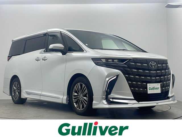 トヨタ アルファード Z 大阪府 2024(令6)年 1.5万km プラチナホワイトパールマイカ モデリスタエアロ/純正14インチディスプレイオーディオ/【BT/フルセグTV/ナビ/USB】/純正13.2インチ後席モニター/左右独立ムーンルーフ/パノラマミックビューモニター/ブラインドスポットモニター(BSM)/デジタルインナーミラー/ETC2.0 /両側パワースライドドア/トヨタセーフティセンス/・プリクラッシュセーフティー/・レーダークルーズコントロール/・レーンディパーチャーアラート/・アダクティブハイビーム/・プロアクティブドライビングサポート/・ドライバー異常対応システム/・パーキングサポートブレーキ/前後コーナーセンサー/ワイヤレス充電/後席オットマン/パワーシート/前後シートヒーター/前後シートベンチレーション/メモリシート/ステリングヒーター/オートホールド