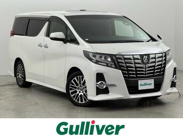 トヨタ アルファード S Cパッケージ 福岡県 2015(平27)年 6.6万km ホワイトパールクリスタルシャイン ツインサンルーフ　/後席モニター　/純正９型ナビ　/セーフティセンス　/レーダークルコン　/両側電動スライドドア　/電動リアゲート　/全席電動シート　/ステアリングヒーター　/ビルトインＥＴＣ　/ドラレコ　/ＷＡＣ　/ＬＥＤ