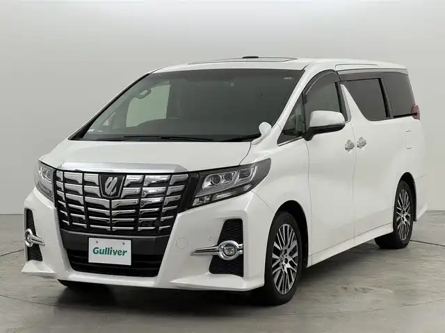 トヨタ アルファード S Cパッケージ 福岡県 2015(平27)年 6.6万km ホワイトパールクリスタルシャイン ツインサンルーフ　/後席モニター　/純正９型ナビ　/セーフティセンス　/レーダークルコン　/両側電動スライドドア　/電動リアゲート　/全席電動シート　/ステアリングヒーター　/ビルトインＥＴＣ　/ドラレコ　/ＷＡＣ　/ＬＥＤ