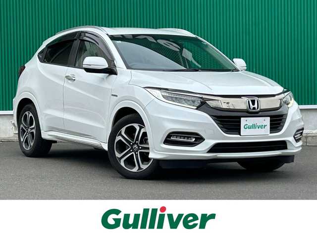 ホンダ ヴェゼル ハイブリッド Z ホンダセンシング 宮城県 2019(令1)年 9.9万km プラチナホワイトパール ワンオーナー/ホンダセンシング/●衝突軽減ブレーキ〈CMBS〉/●誤発進抑制機能/●歩行者事故低減ステアリング/●路外逸脱抑制機能/●ACC〈アダプティブ・クルーズ・コントロール〉/●LKAS〈車線維持支援システム〉/●先行車発進お知らせ機能/●標識認識機能/コンフォートビューパッケージ/●親水/ヒーテッドドアミラー/●フロントドア撥水ガラス/●熱線入りフロントウインドウ/純正SDナビ/・Bluetooth/・フルセグTV/・CD/DVD/バックカメラ/ドライブレコーダー/ETC/ハーフレザーシート/運転席・助手席シートヒーター/チップアップシート/革巻きステアリング/ステアリングスイッチ/LEDヘッドランプ/オートライト/電子制御パーキングブレーキ/オートブレーキホールド機能/プッシュスタート＆スペアキー/ルーフレール/純正17AW/ドアバイザー/W/サイド/カーテンエアバッグ/取扱説明書/保証書