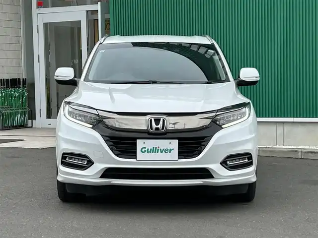 ホンダ ヴェゼル ハイブリッド Z ホンダセンシング 宮城県 2019(令1)年 9.9万km プラチナホワイトパール ワンオーナー/ホンダセンシング/●衝突軽減ブレーキ〈CMBS〉/●誤発進抑制機能/●歩行者事故低減ステアリング/●路外逸脱抑制機能/●ACC〈アダプティブ・クルーズ・コントロール〉/●LKAS〈車線維持支援システム〉/●先行車発進お知らせ機能/●標識認識機能/コンフォートビューパッケージ/●親水/ヒーテッドドアミラー/●フロントドア撥水ガラス/●熱線入りフロントウインドウ/純正SDナビ/・Bluetooth/・フルセグTV/・CD/DVD/バックカメラ/ドライブレコーダー/ETC/ハーフレザーシート/運転席・助手席シートヒーター/チップアップシート/革巻きステアリング/ステアリングスイッチ/LEDヘッドランプ/オートライト/電子制御パーキングブレーキ/オートブレーキホールド機能/プッシュスタート＆スペアキー/ルーフレール/純正17AW/ドアバイザー/W/サイド/カーテンエアバッグ/取扱説明書/保証書